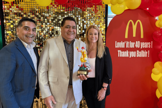Indian American success stories, Indian immigrants USA, McDonald's Balbir Singh celebration, American Dream stories